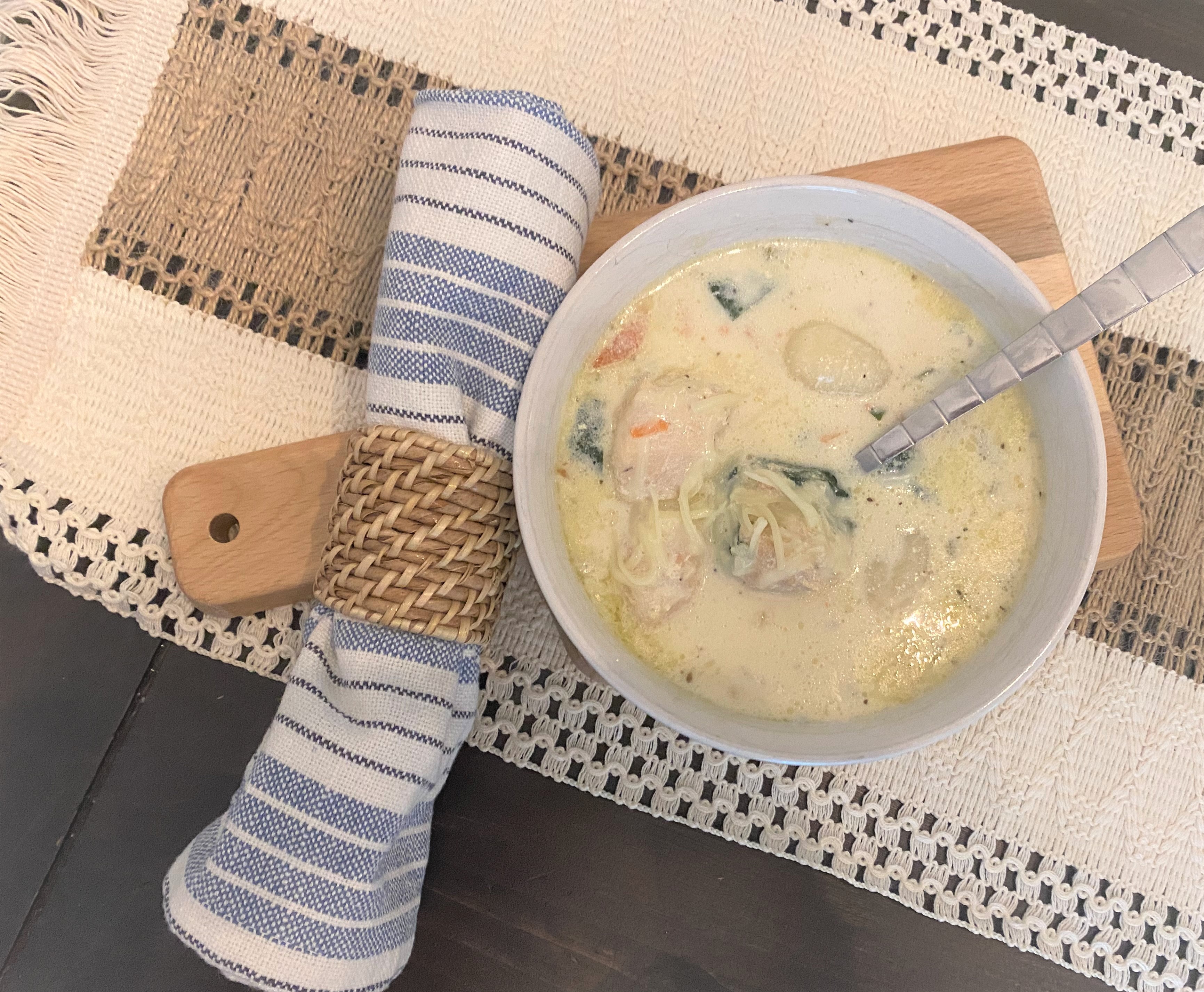 Finished chicken gnocchi soup on a pretty table